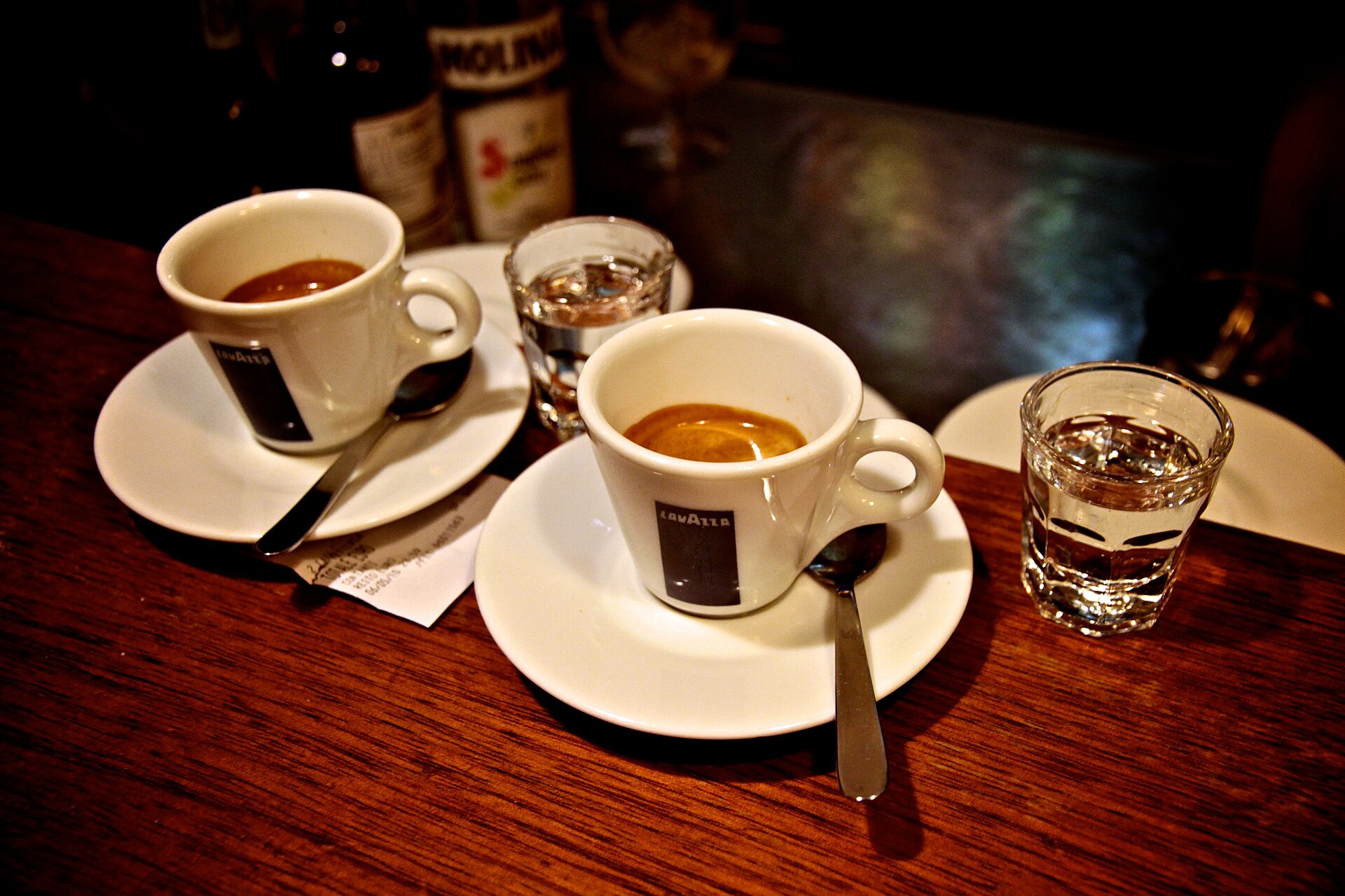 Espresso and sambuca served separately, as identified by the photographer. The photo does not establish the featured quantities.