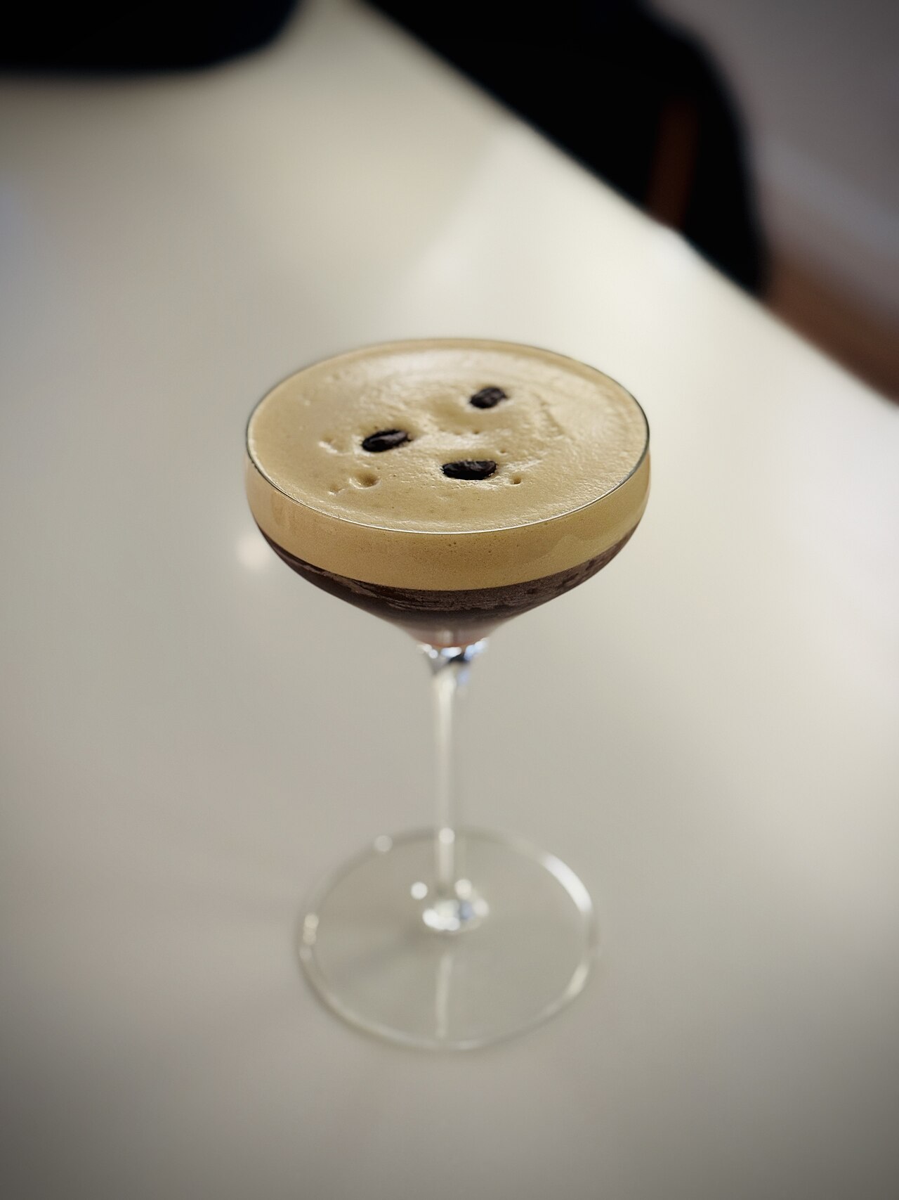Source-identified espresso martini made with Sabe at Moziak, Sonoma. The photograph shows a real cocktail presentation, not proof that the IBA vodka ingredients were used.