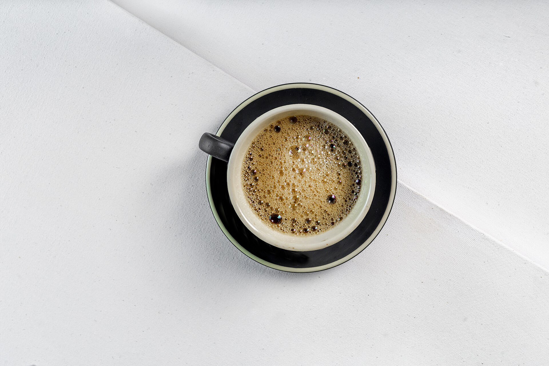 A real espresso serving. Crema and cup appearance do not establish the coffee dose or liquid yield.