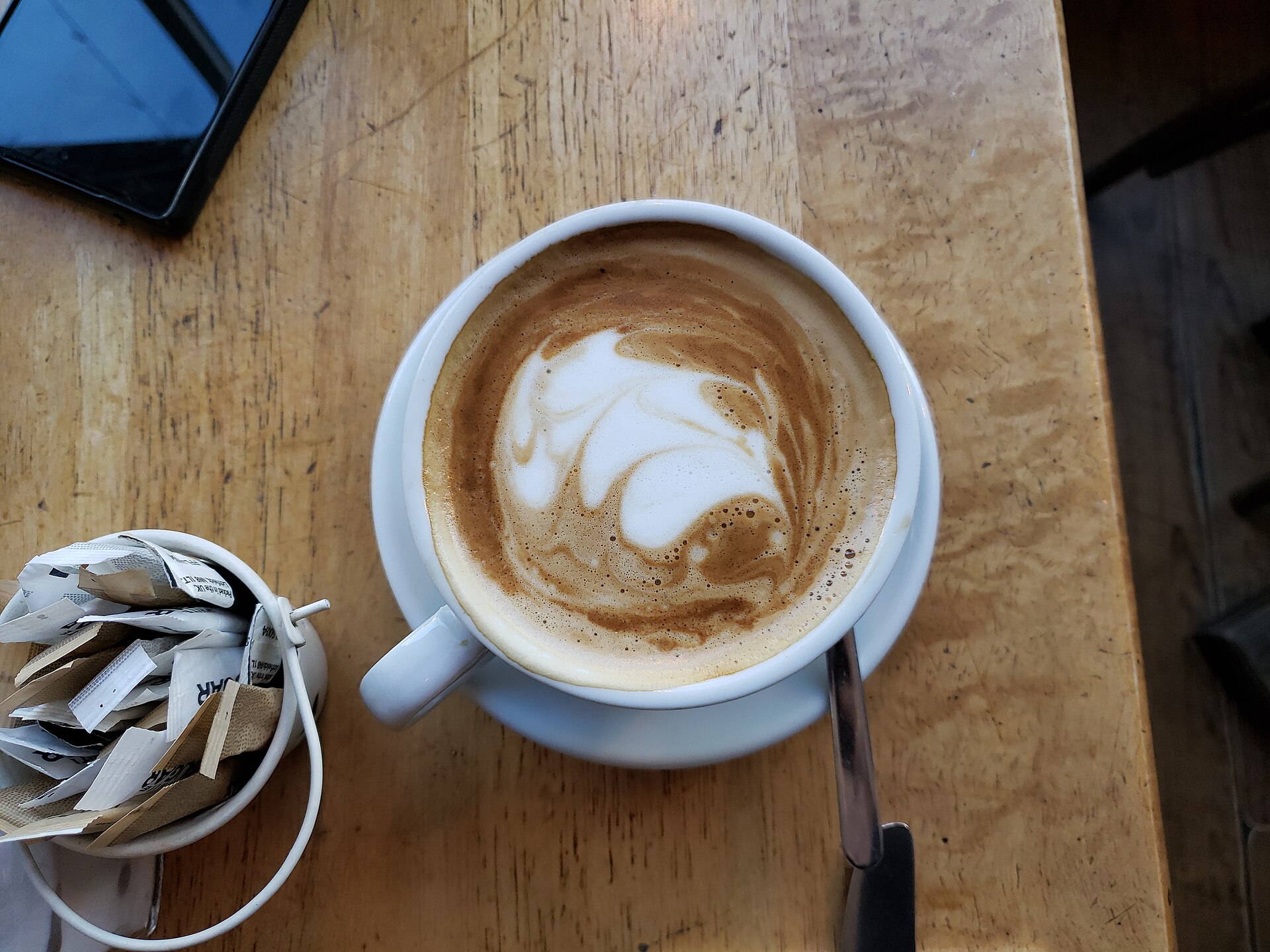 Flat white photographed at Si Signore, Brighton. Cup size and recipe may differ from the starting method.