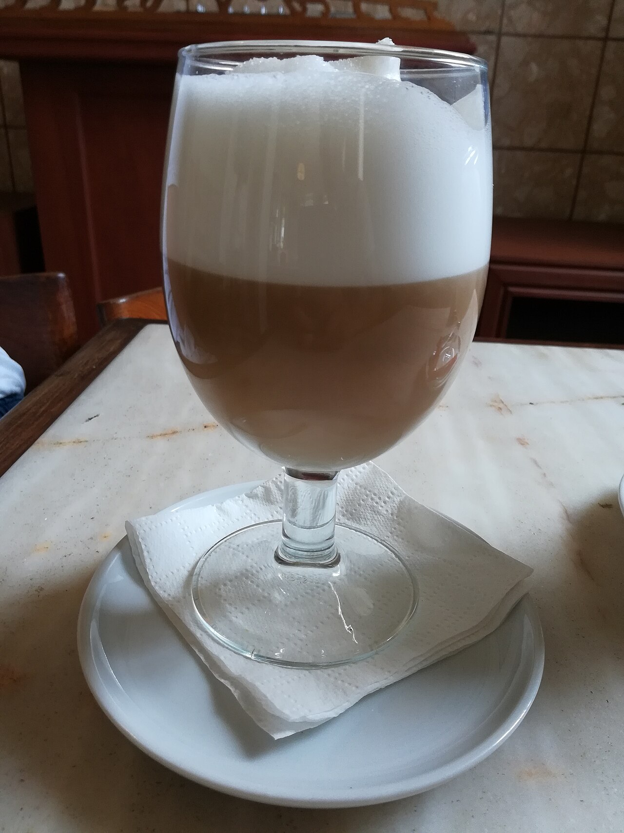 A source-identified galão served in Horta, Azores. The glass presentation illustrates one real serving, not the exact producer recipe.