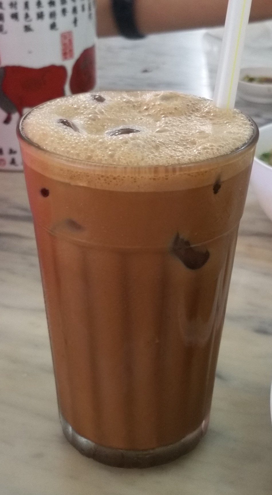 Source-identified iced Ipoh white coffee from Menglembu. The photograph does not establish that OLDTOWN products were used.