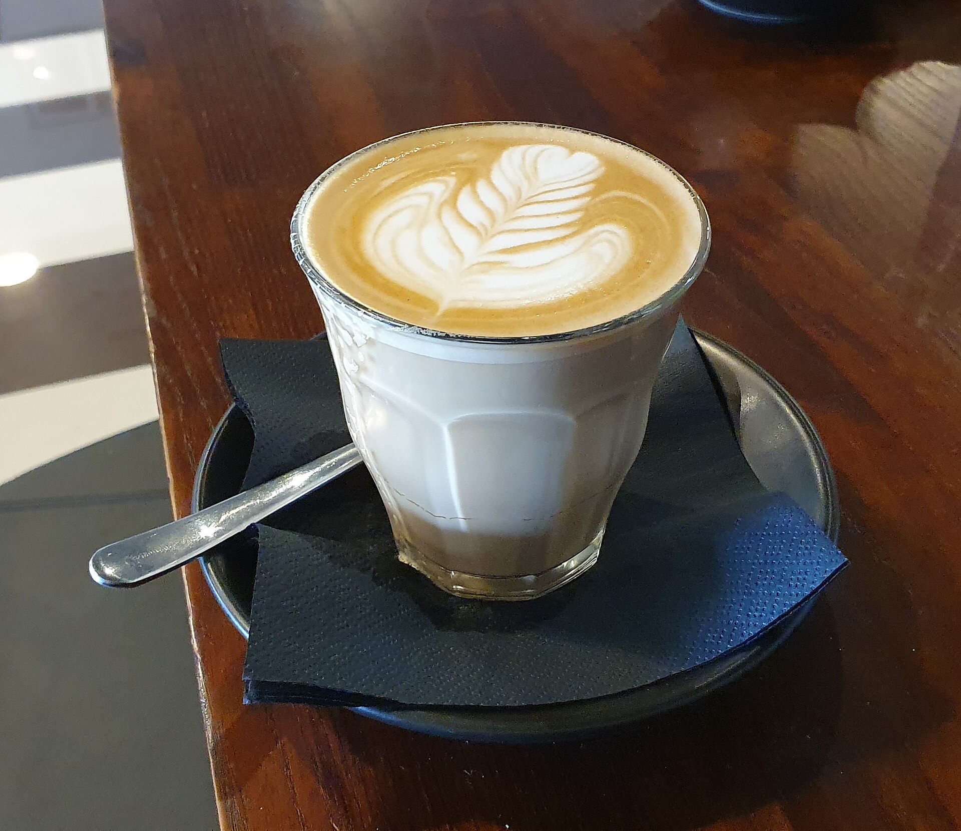Latte photographed at Pulse Café, South Australia. The named home method is a separate example.