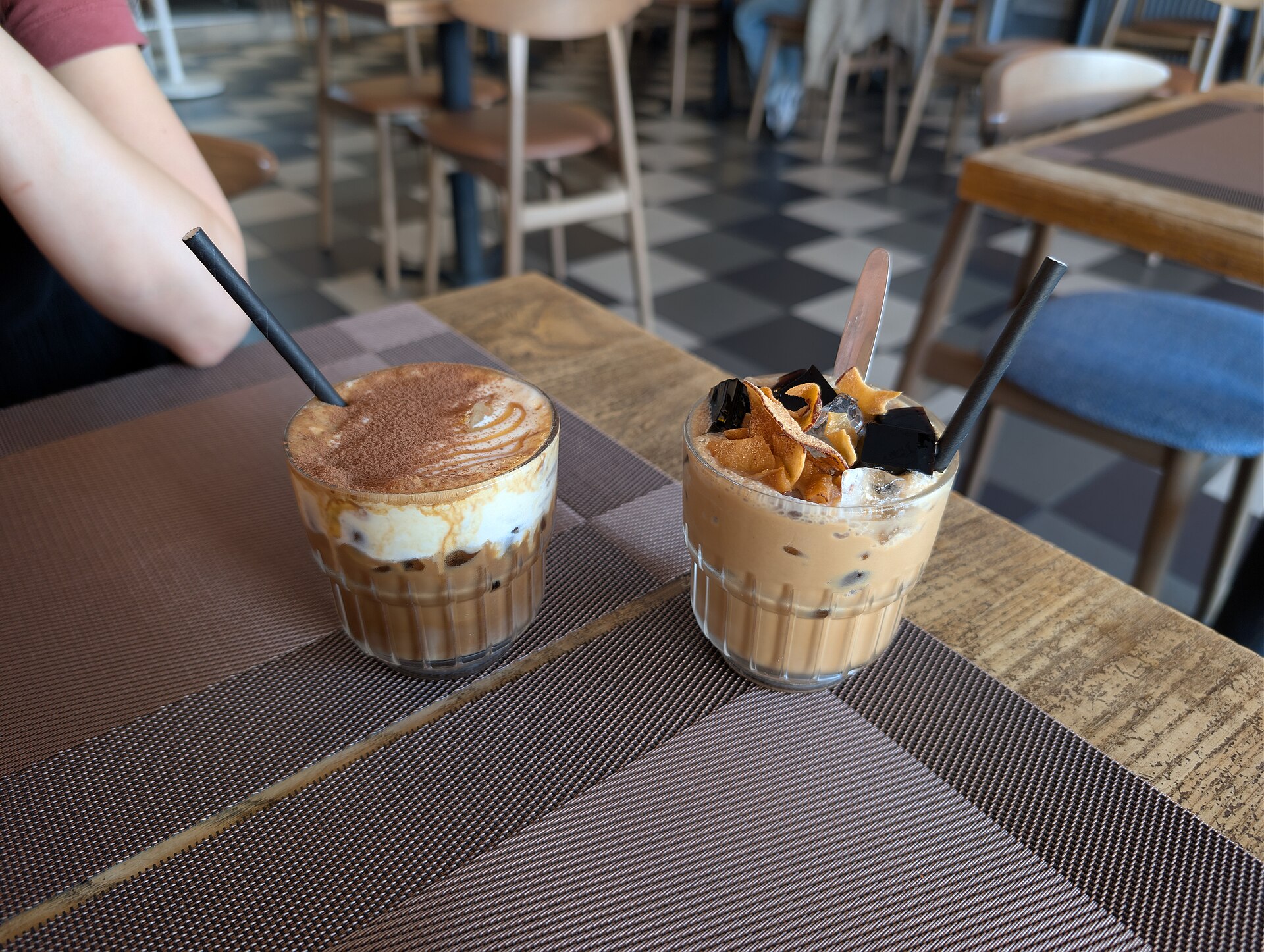 Coconut coffee is the right-hand drink at Xin Chao, Eastbourne; salted coffee is on the left. This named cafe version has extra toppings and differs from the simpler featured home recipe.