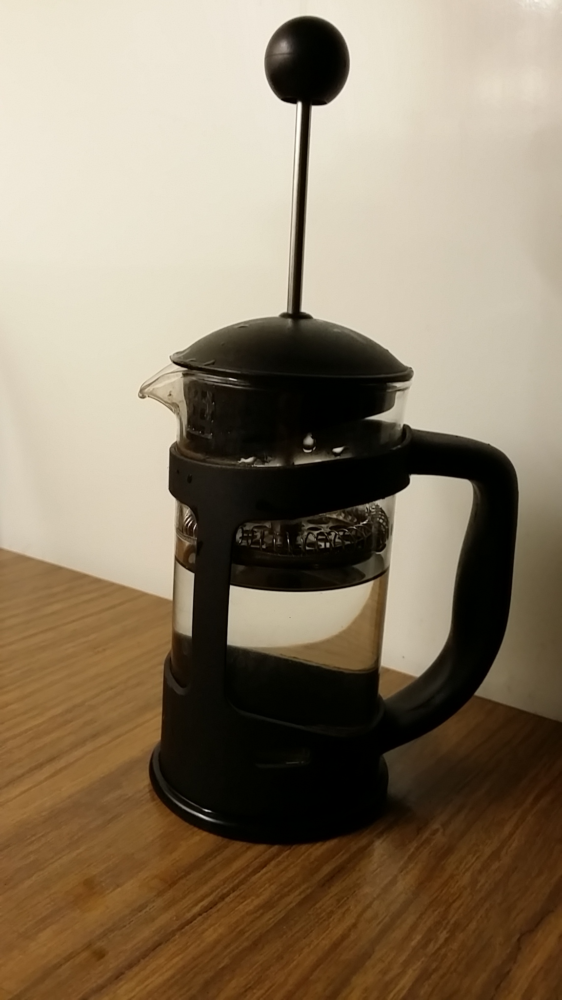 A real coffee plunger with its mesh assembly raised